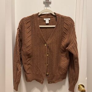 Cupcakes and cashmere cardigan.